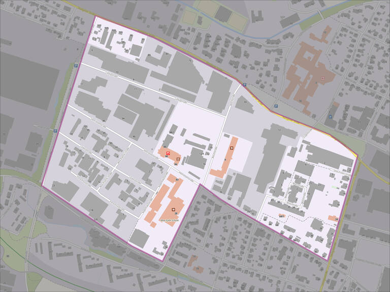 Die Abbildung zeigt einen Stadtplan mit eingezeichneten Grundstücksgrenzen, Gebäuden und Straßen, wobei einige Bereiche farblich hervorgehoben sind.